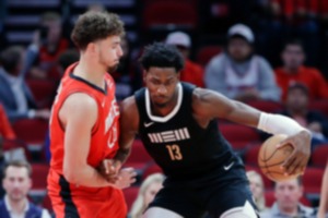 <strong>Memphis Grizzlies forward Jaren Jackson Jr. (13) drives into Houston Rockets center Alperen Sengun Wednesday, Dec. 13, 2023, in Houston.</strong> (Michael Wyke/AP)