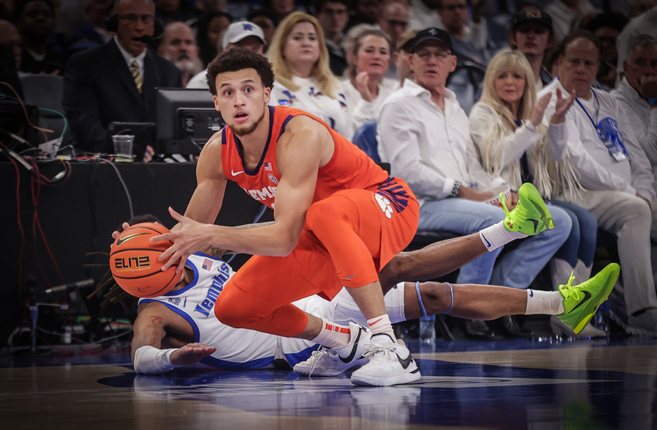<strong>University of Memphis guard Caleb Mills (9) dives for a loose ball against Clemson guard Chase Hunter (1) during a Dec. 16, 2023 game. Memphis edged Clemson, 79-77.</strong> (Patrick Lantrip/The Daily Memphian)