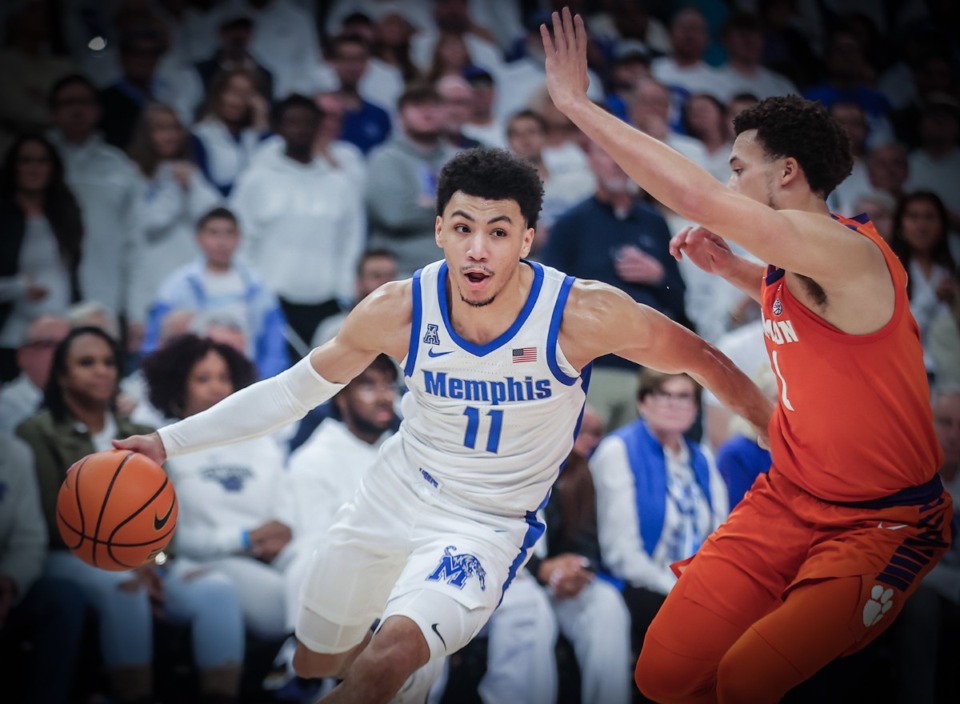 <strong>University of Memphis guard Jahvon Quinerly (11) drives to the basket during a Dec. 16, 2023 game against Clemson.</strong> (Patrick Lantrip/The Daily Memphian)