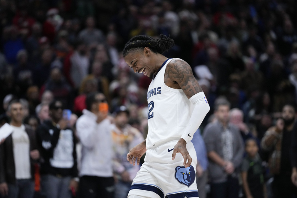 <strong>Memphis Grizzlies guard Ja Morant (12) reacts after the New Orleans Pelicans missed a key basket in the second half of an NBA basketball game in New Orleans, Tuesday, Dec. 19. The Grizzlies won 115-113.</strong> (Gerald Herbert/AP Photo)