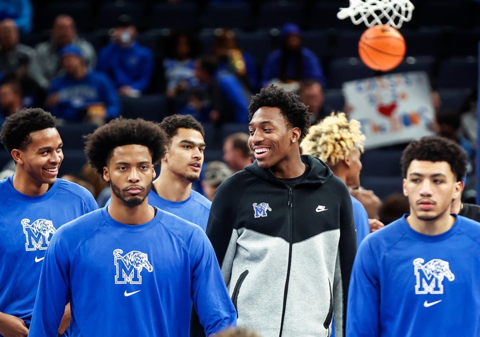 <strong>New player Nae'Qwan Tomlin (second right) needs confirmation of graduation from Kansas State to play with the Memphis Tigers.</strong>&nbsp;(Mark Weber/The Daily Memphian file)