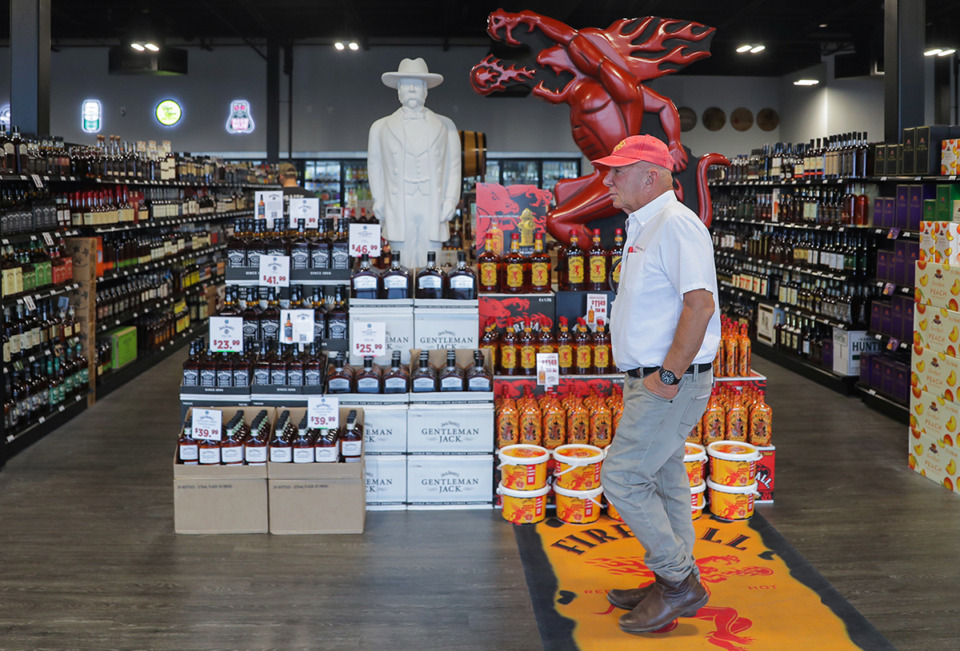 <strong>The Lake District developer Yehuda Netanel walks by a display at Lake District Wine and Liquor during the opening of several Lake District shops Nov. 4, 2022.</strong> (Patrick Lantrip/The Daily Memphian file)