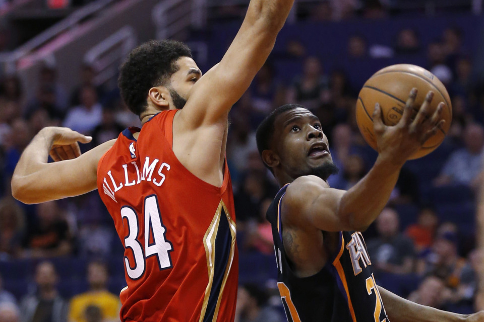 <p class="regdt"><strong>Phoenix Suns forward Josh Jackson drives past New Orleans Pelicans guard Kenrich Williams (34) during the second half of an NBA game on April 5, 2019, in Phoenix.&nbsp;</strong>(AP Photo/Rick Scuteri)