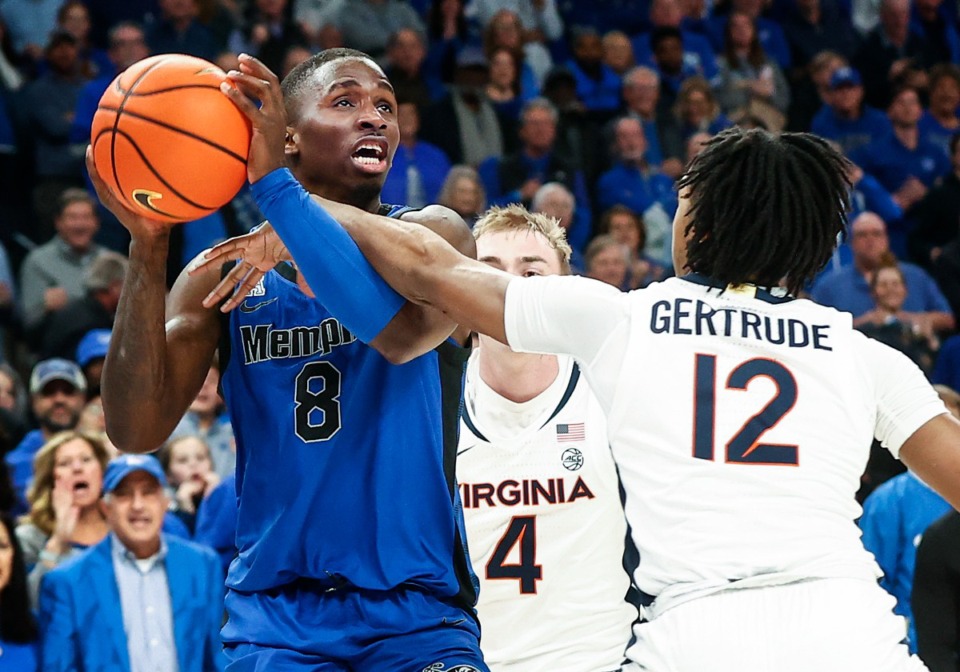 <strong>Memphis Tigers guard David Jones (left) is fouled by Virginia defender Elijah Gertrude (right) during action on Tuesday, Dec. 19, 2023.</strong> (Mark Weber/The Daily Memphian)