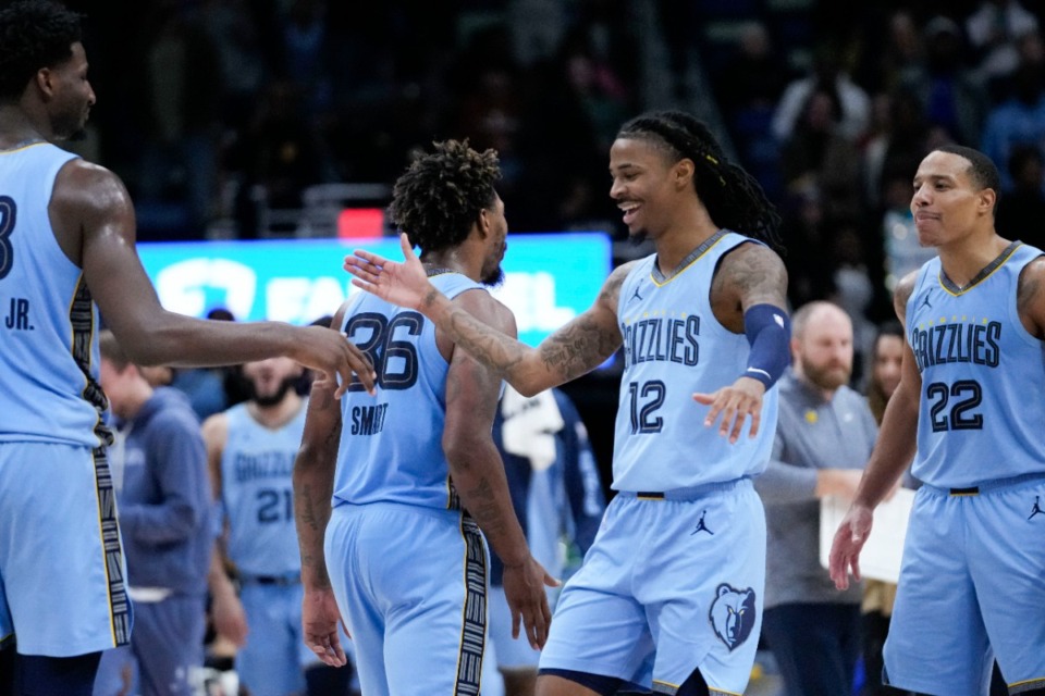 <strong>Memphis Grizzlies guard Ja Morant (12) celebrates after his slam dunk in the final seconds of overtime against the New Orleans Pelicans in New Orleans, Tuesday, Dec. 26, 2023. The Grizzlies won 116-115.</strong> (Gerald Herbert/AP)