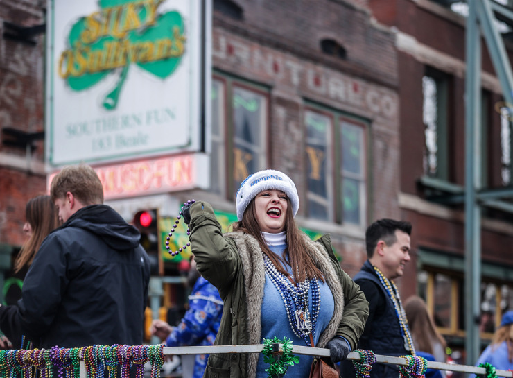 <strong>People pass out beads and candy from floats during the AutoZone Liberty Bowl Parade on Beale Street Dec. 28, 2023.</strong> (Patrick Lantrip/The Daily Memphian)