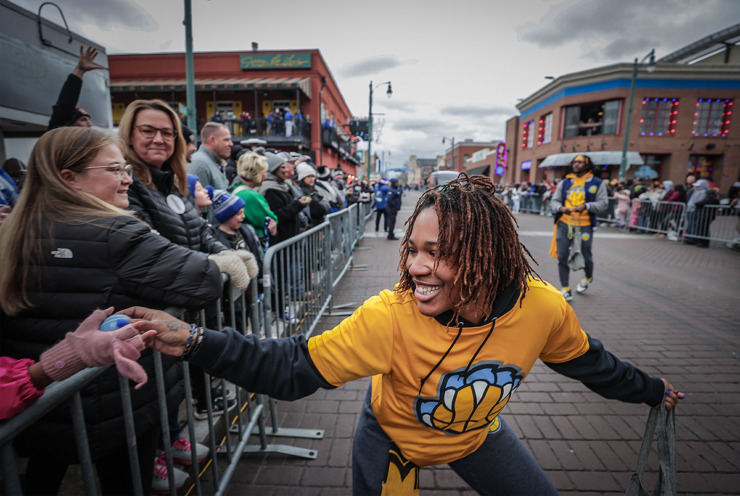 <strong>Members of the Memphis Grizzlies Claw Crew hand out candy during the AutoZone Liberty Bowl Parade on&nbsp;Beale Street Dec. 28, 2023.</strong> (Patrick Lantrip/The Daily Memphian)