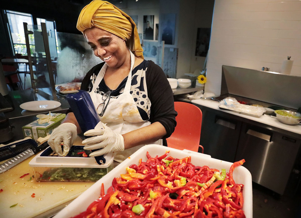 <strong>Ibtisam Salih from Sudan prepares food for the dinner rush at the Global Cafe in Crosstown Concourse Oct. 10, 2019.</strong> (Jim Weber/The Daily Memphian file)
