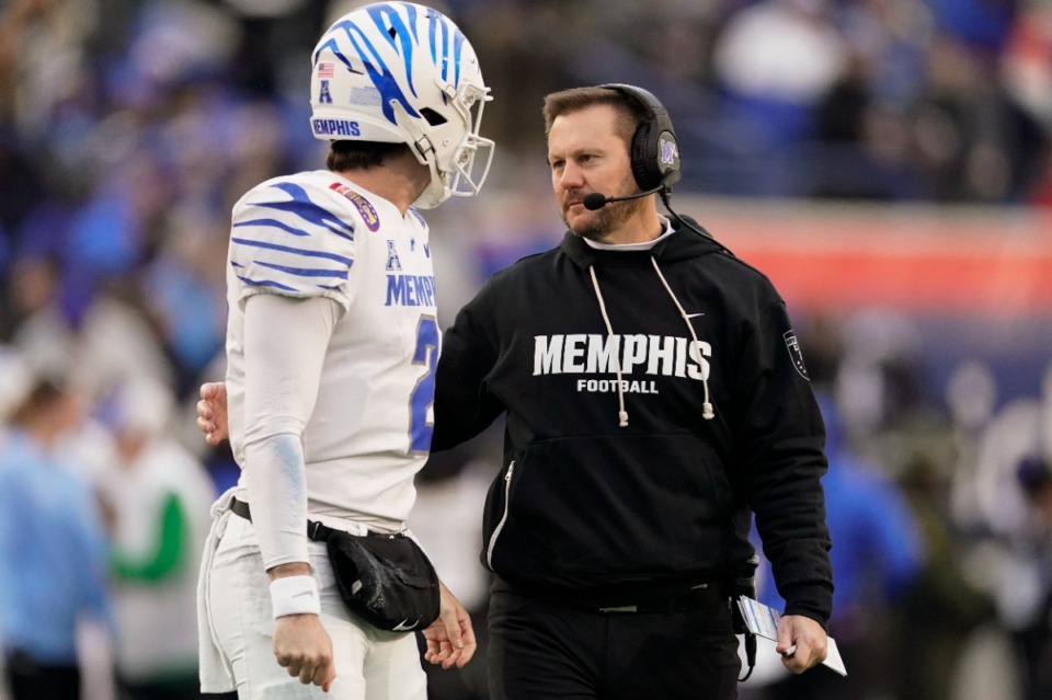 <strong>Memphis head coach Ryan Silverfield, right, talks to quarterback Seth Henigan (2) during the Liberty Bowl game against Iowa State on Friday, Dec. 29, 2023.</strong> (George Walker IV/AP)