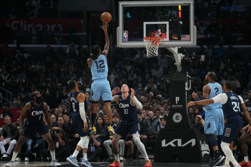 <strong>Memphis Grizzlies guard Ja Morant (12) shoots the ball during the first quarter of an NBA basketball game against the Los Angeles Clippers in Los Angeles, Friday, Dec. 29, 2023.</strong> (Damian Dovarganes/AP)