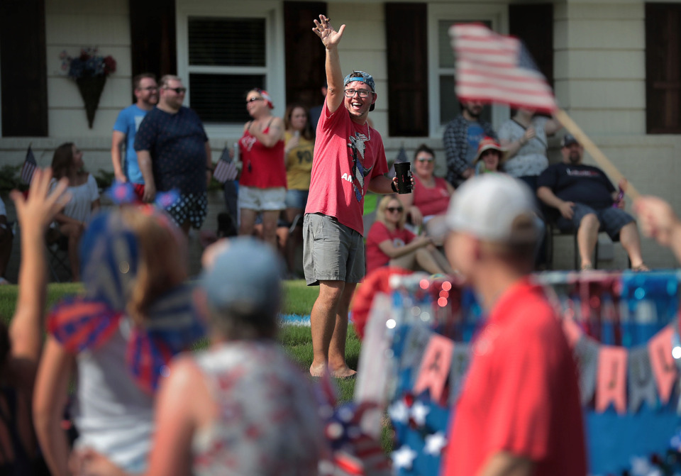 <strong>Neighbors gather to watch the parade as it passes on Mimosa Avenue during the 70th annual Independence Day Parade in the High Point Terrace neighborhood on July 4, 2019. Once again East Memphis residents gathered for a patriotic morning of star-spangled bikes, waving neighbors and a dousing by the Memphis Fire Department.</strong> (Jim Weber/Daily Memphian)