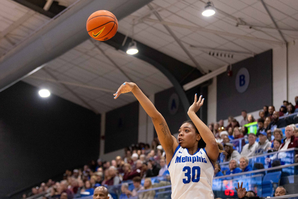 <strong>Alasia Smith shoots a three for the Tigers at the Elma Roane Fieldhouse in Memphis Dec. 17.</strong> (Ryan Beatty/Special to The Daily Memphian)