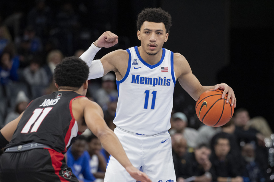 <strong>Memphis guard Jahvon Quinerly, right, signals to teammates as Austin Peay guard Dezi Jones defends during the first half of the game Saturday, Dec. 30, 2023. The Tigers climb up one spot in Upadhyaya&rsquo;s ranking.</strong> (Nikki Boertman/AP Photo)