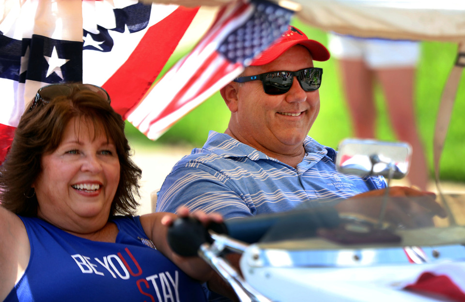 <strong>Joni and John Chalmers peddle their PPV (person powered vehicle) down Carr Avenue during the Central Gardens Fourth of July parade</strong>. (Patrick Lantrip/Daily Memphian)