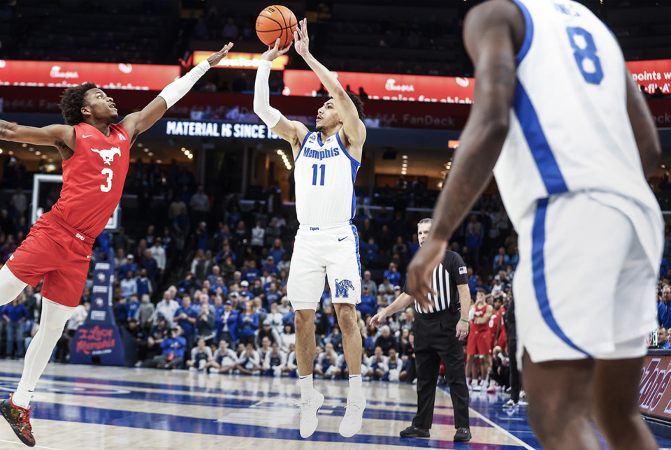 <strong>University of Memphis guard Jahvon Quinerly (middle) hits a game-winning 3-point shot against SMU during action on Sunday, Jan. 7.</strong> (Mark Weber/The Daily Memphian)