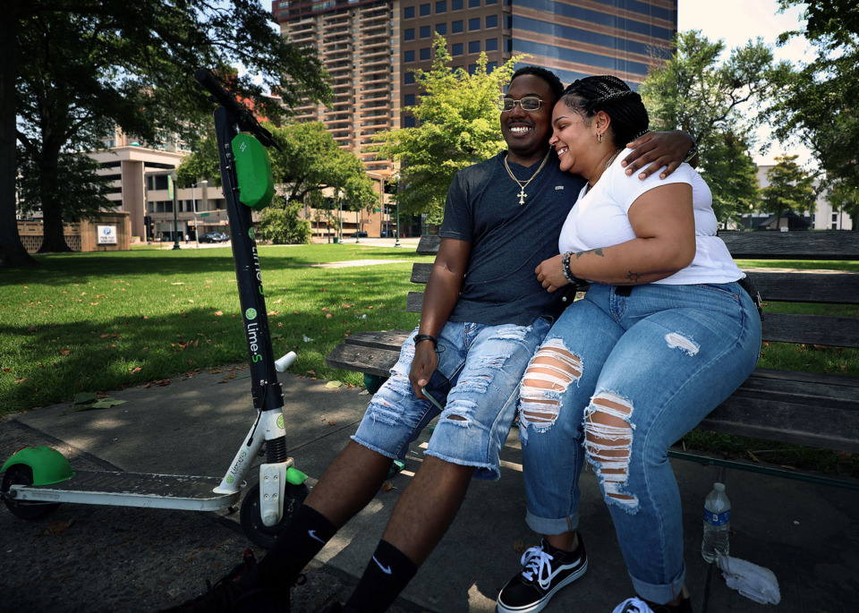 <strong>Michael Gaines and Jessica Maina, who are visiting Memphis from South Carolina, joke with each other while taking a break from exploring Downtown at Memphis Park Friday, July 5, 2019. The Memphis River Parks Partnership wants to remake the park into a casual gathering place.</strong>&nbsp;(Patrick Lantrip/Daily Memphian)