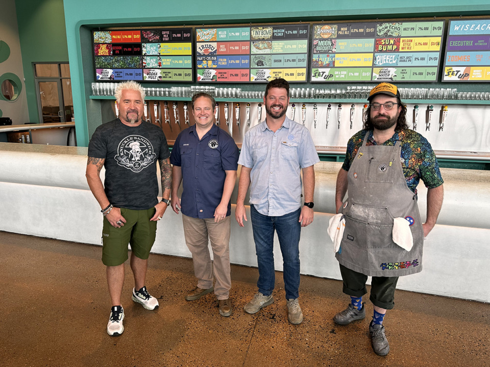<strong>Guy Fieri, celebrity chef (far left), visited with Davin Bartosch (middle left), Kellan Bartosch (middle right) and Little Bettie chef Jared Riddle (far right) when he stopped at the Downtown Wiseacre location to eat at the Little Bettie pizzeria inside the brewery. Wiseacre&rsquo;s Little Bettie will appear on Season 38, Episode 12, of &ldquo;Diners, Drive-Ins and Dives."</strong> (Courtesy Kellan Bartosch)