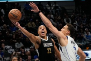 <strong>Memphis Grizzlies guard Desmond Bane (22) drives against Dallas Mavericks center Dwight Powell (7) in Dallas, Tuesday, Jan. 9, 2024.</strong> (LM Otero/AP)