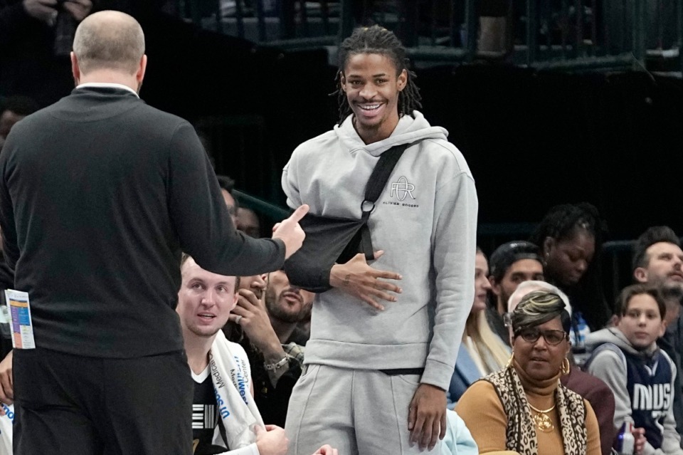 <strong>Injured Memphis Grizzlies guard Ja Morant musters a smile&nbsp;during the game against the Dallas Mavericks in Dallas, Tuesday, Jan. 9, 2024.</strong> (LM Otero/AP)