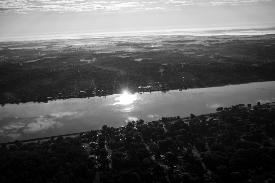 <strong>The sun rises over the upper Mississippi River north of the Quad Cities of Iowa and Illinois on Sept. 18, 2023. Aerial support provided by LightHawk.</strong> (Nick Rohlman/The Gazette file)