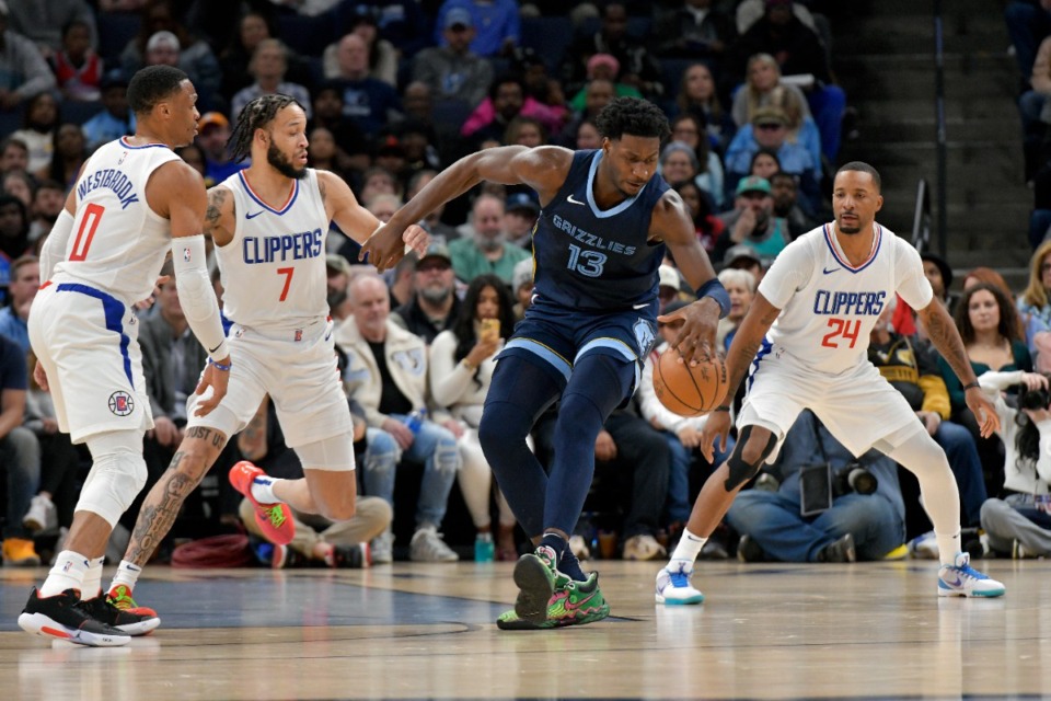 <strong>Memphis Grizzlies forward Jaren Jackson Jr. (13) dribbles through Los Angeles Clippers guards Russell Westbrook (0), Amir Coffey (7) and Norman Powell (24) on Friday, Jan. 12, 2024.</strong> (Brandon Dill/AP)