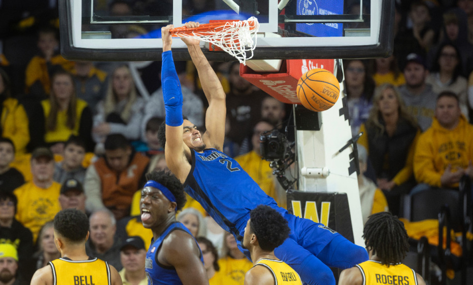 <strong>Memphis' Nicholas Jourdain dunks the ball during the first half of an NCAA college basketball game against Wichita State, Sunday, Jan. 14, 2024, in Wichita, Kan.</strong> (Travis Heying/The Wichita Eagle via AP)