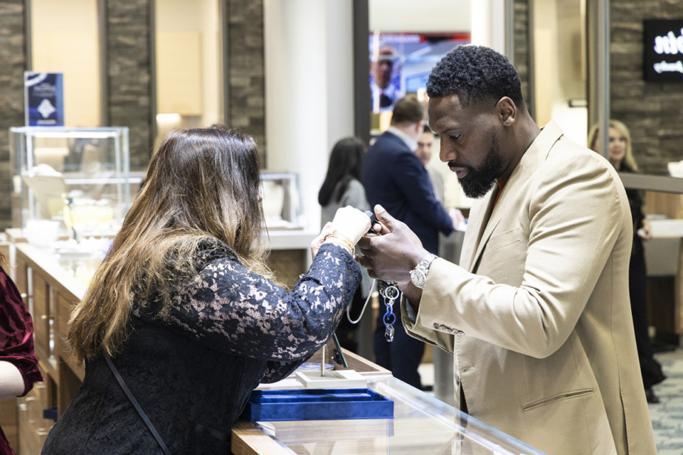 <strong>Tony Allen, right, looks at jewelry during the grand opening and ribbon-cutting for Sissy&rsquo;s Log Cabin.</strong> (Brad Vest/Special to The Daily Memphian)