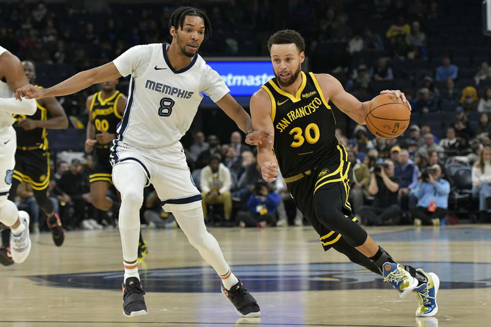 <strong>Golden State Warriors guard Stephen Curry (30) drives against Memphis Grizzlies forward Ziaire Williams (8) in the first half of an NBA basketball game Monday, Jan. 15, 2024, in Memphis, Tenn.</strong> (AP Photo/Brandon Dill)