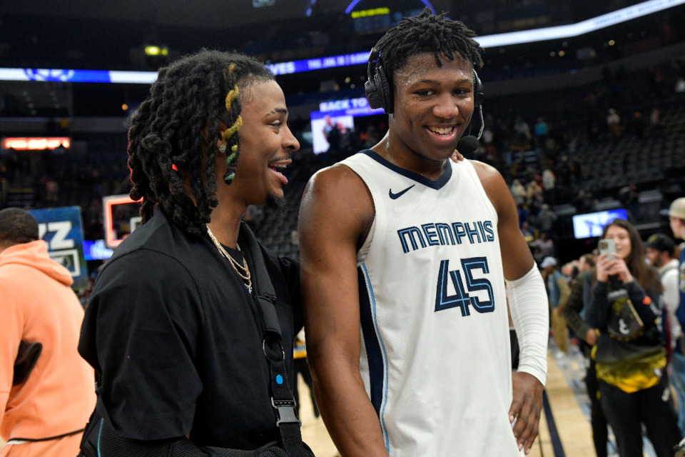 <strong>Memphis Grizzlies guard Ja Morant, left, greets Memphis forward GG Jackson (45) during a live interview after an NBA basketball game between the Grizzlies and the Golden State Warriors Monday, Jan. 15, 2024, in Memphis, Tenn.</strong> (AP Photo/Brandon Dill)