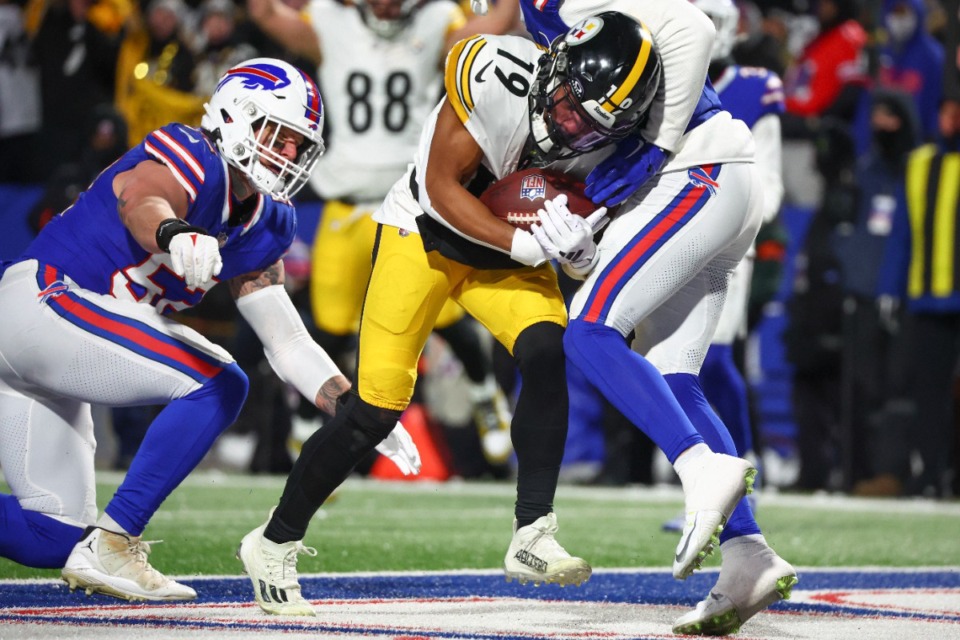 <strong>Pittsburgh Steelers wide receiver Calvin Austin III (19) scores a touchdown against the Buffalo Bills during the fourth quarter of an NFL wild-card playoff football game, Monday, Jan. 15, 2024, in Buffalo, N.Y.</strong> (AP Photo/Jeffrey T. Barnes)
