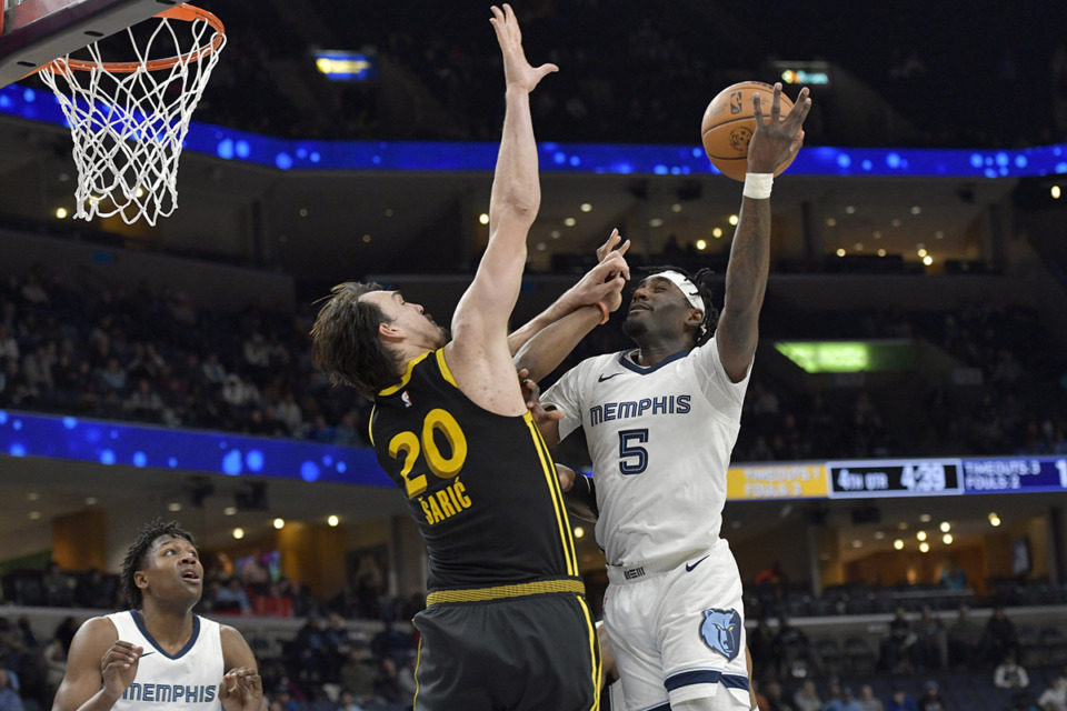 <strong>Memphis Grizzlies guard Vince Williams Jr. (5) shoots against Golden State Warriors forward Dario Saric (20) in the Jan. 15, 2024, victory.</strong> (Brandon Dill/AP file)