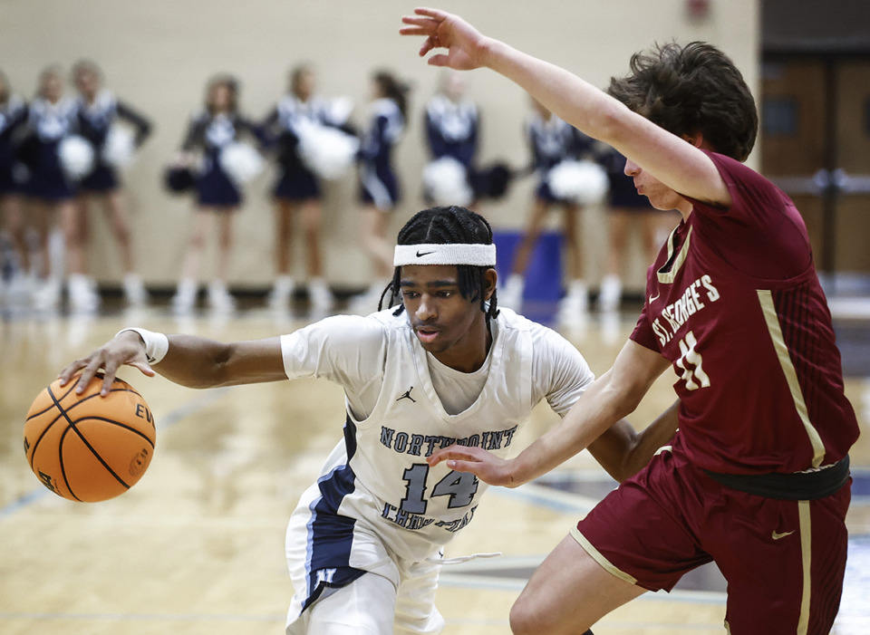 <strong>Northpoint Ayden Kelley (left) drives the lane against the defense on Tuesday, Jan. 9. Kelley said his dad, Tony Harris, encouraged him to play basketball.</strong> (Mark Weber/The Daily Memphian)