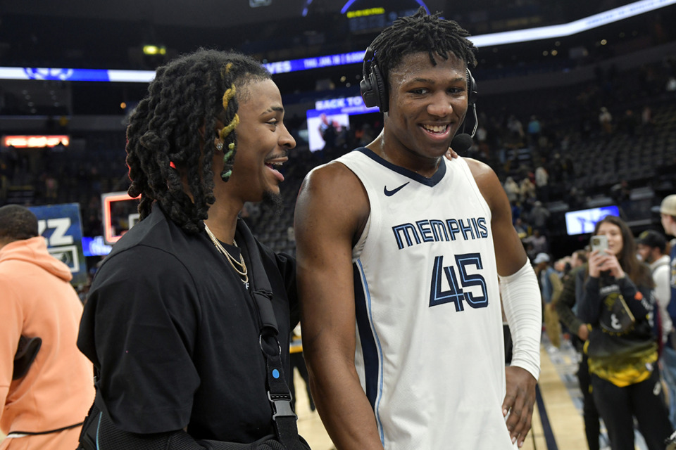 <strong>Memphis Grizzlies guard Ja Morant, left, greets Memphis forward GG Jackson (45) during a live interview after an NBA basketball game between the Grizzlies and the Golden State Warriors Monday, Jan. 15, 2024 at FedexForum.</strong> (Brandon Dill/AP Photo)