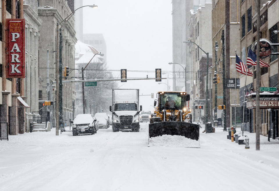 <strong>Plows clear streets downtown as snow falls Jan. 15.</strong> (Mark Weber/The Daily Memphian)