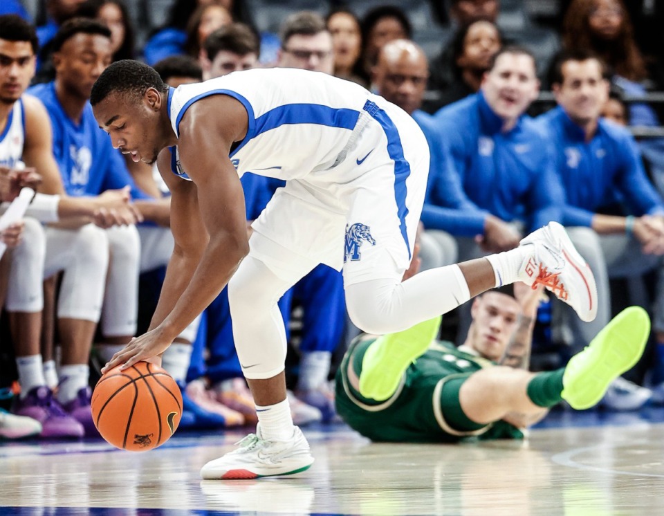 <strong>University of Memphis defender Jayhlon Young grabs a loose ball against the University of South Florida on Thursday, Jan. 18, 2024.</strong> (Mark Weber/The Daily Memphian)
