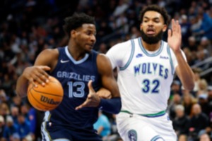 <strong>Memphis Grizzlies forward Jaren Jackson Jr. (13) works toward the basket on the way to 36 points as Minnesota Timberwolves center Karl-Anthony Towns (32) defends on Thursday, Jan. 18, 2024, in Minneapolis.</strong> (Matt Krohn/AP)