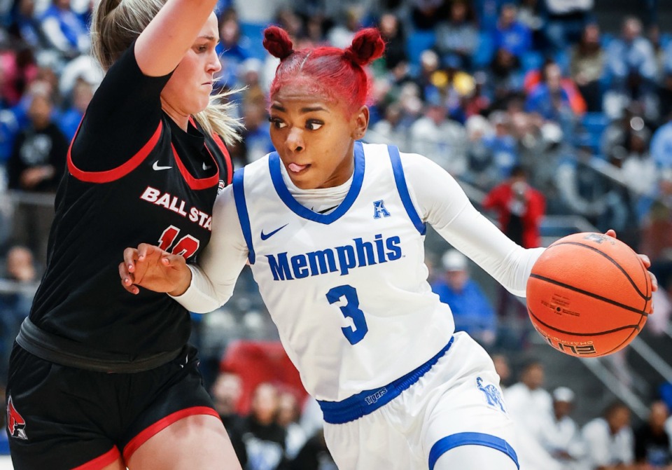 <strong>Memphis Tigers guard Shelbee Brown (right) drives the lane against the Ball State defense during action of their WNIT game on Monday, March 20, 2023.&nbsp;Saturday&rsquo;s home game against FAU will be played at FedExForum due to winter weather on the U of M campus.&nbsp;</strong>(Mark Weber/The Daily Memphian file)