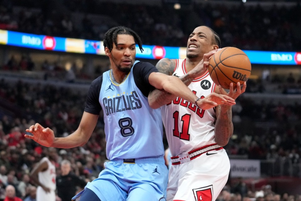 <strong>Memphis Grizzlies' Ziaire Williams blocks Chicago Bulls' DeMar DeRozan (11) during the first half of an NBA basketball game Saturday, Jan. 20, 2024, in Chicago.</strong> (AP Photo/Charles Rex Arbogast)
