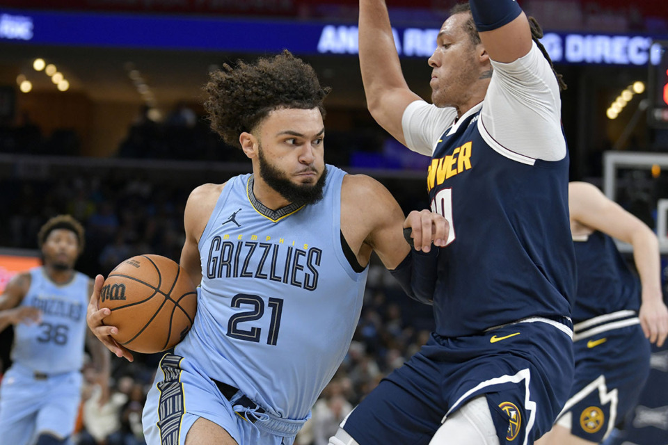 <strong>Memphis Grizzlies forward David Roddy (21) drives against Denver Nuggets forward Aaron Gordon (50) during the first half of an NBA basketball game Friday, Oct. 27, 2023, in Memphis.</strong> (Brandon Dill/AP file)