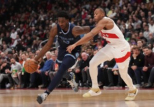 <strong>Memphis Grizzlies forward Jaren Jackson Jr. (13) drives past Toronto Raptors forward Scottie Barnes (4) in Toronto on Monday, Jan. 22, 2024.</strong> (Nathan Denette/The Canadian Press via AP)