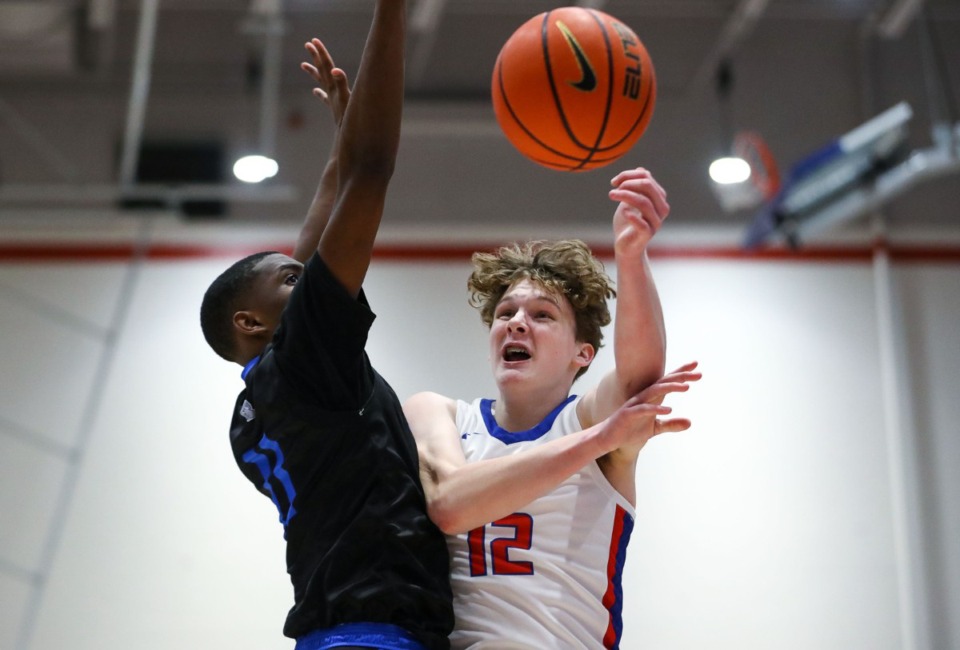 <strong>Bartlett High forward Jack Shackelford (12) tries to power though to the basket during a TSSAA regional quarter final game against Overton High Feb. 26, 2022.</strong> (Patrick Lantrip/The Daily Memphian file)