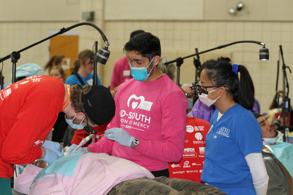 <strong>Volunteers treat patients at previous Mid-South Mission of Mercy events.</strong> (Courtesy Mid-South Mission of Mercy)