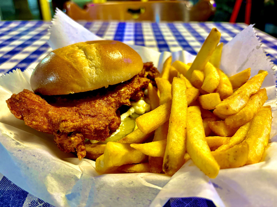 <strong>Memphis-based Gus&rsquo;s World Famous Fried Chicken's new fried chicken sandwich comes with a boneless thigh, bread-and-butter pickles and mayonnaise and is served with french fries.</strong> (Joshua Carlucci/Special to The Daily Memphian)