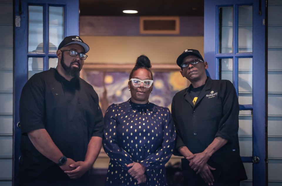 <strong>Mahogany Memphis owner Carlee McCullough, center, poses for a portrait flanked by her two executive chefs Perrie Ware, left, and Anthony Crumpton at the East Memphis restaurant.</strong> (Patrick Lantrip/The Daily Memphian)
