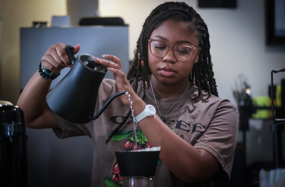 <strong>Syndi Barnes prepares a fresh pot of coffee at Cxffeeblack's location on National Street Sept. 21, 2023.</strong> (Patrick Lantrip/The Daily Memphian)
