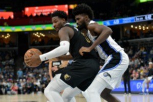 <strong>Memphis Grizzlies forward Jaren Jackson Jr., left, handles the ball against Orlando Magic forward Jonathan Isaac, right, in the first half of an NBA basketball game Friday, Jan. 26, 2024, at FedExForum.</strong> (AP Photo/Brandon Dill)