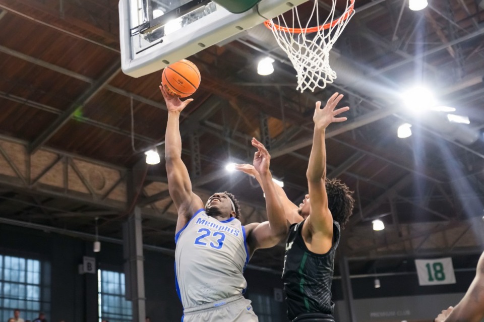 <strong>Memphis forward Malcolm Dandridge (23) is fouled by Tulane forward Collin Holloway during the second half of an NCAA college basketball game in New Orleans, Sunday, Jan. 21, 2024. Tulane won 81-79.</strong> (AP Photo/Gerald Herbert)
