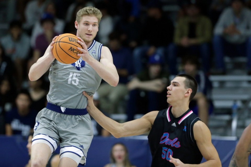 <strong>Rice forward Max Fiedler (15), a 6-foot-11 center, averages 9.8 points while grabbing a team-high 9.9 rebounds and dishing out a team-high 5.4 assists per game.</strong> (Michael Wyke/AP file)