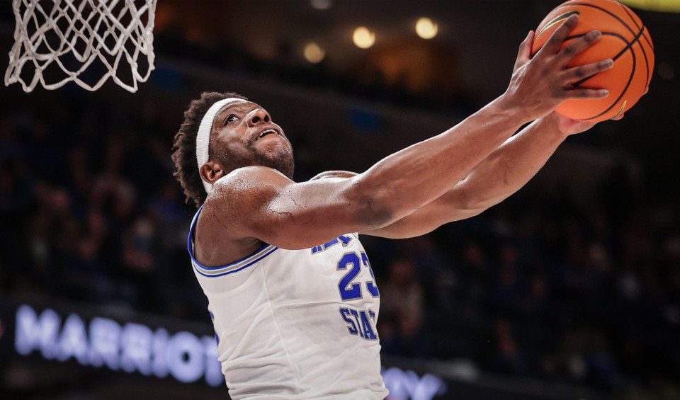 <strong>Memphis forward Malcolm Dandridge (23) tries to go up for a reverse dunk during a Jan. 31, 2024 game against Rice.</strong> (Patrick Lantrip/The Daily Memphian)