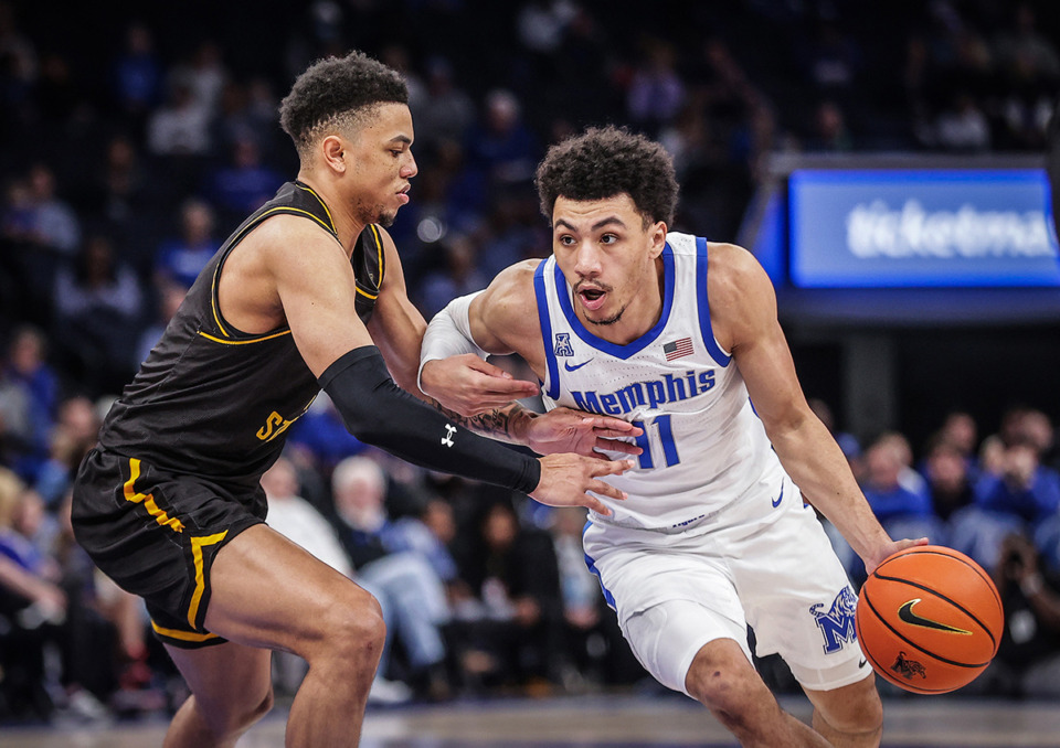 <strong>University of Memphis guard Jahvon Quinerly, 11, drives to the basket during a Feb. 3 game against Wichita State.</strong> (Patrick Lantrip/The Daily Memphian)
